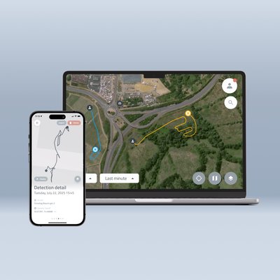 Picture of Dronetag Cloud Platform shown on a mobile phone and laptop